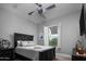 Guest bedroom with a ceiling fan and window shutters at 29615 N 55Th Pl, Cave Creek, AZ 85331