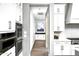 Contemporary kitchen featuring white cabinetry, stainless steel appliances, and sleek countertops at 29615 N 55Th Pl, Cave Creek, AZ 85331