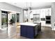 Expansive kitchen with a generous island, stainless appliances, and sliding glass doors to the outdoor space at 29615 N 55Th Pl, Cave Creek, AZ 85331