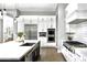 Gourmet kitchen highlighting stainless steel appliances, double ovens, and an oversized island with a sink at 29615 N 55Th Pl, Cave Creek, AZ 85331