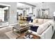 Bright, open living space showcases hardwood floors, plush seating, and seamless flow to a modern kitchen at 29615 N 55Th Pl, Cave Creek, AZ 85331