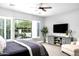 Serene main bedroom with a large window overlooking the landscaped backyard and pool at 29615 N 55Th Pl, Cave Creek, AZ 85331