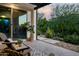 Cozy covered patio area with comfortable seating, ideal for relaxing and enjoying the garden view at 29615 N 55Th Pl, Cave Creek, AZ 85331