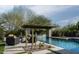 Relaxing pool area with cactus landscaping and seating at 29615 N 55Th Pl, Cave Creek, AZ 85331