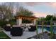 Relaxing pool and patio area with fire pit and pergola at 29615 N 55Th Pl, Cave Creek, AZ 85331