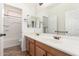 Clean bathroom with double sinks and wood cabinets at 31032 N Obsidian Dr, San Tan Valley, AZ 85143