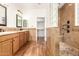 Elegant bathroom with double sinks, walk-in shower, and tile at 31032 N Obsidian Dr, San Tan Valley, AZ 85143