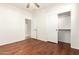 Well-lit bedroom with hardwood floors and closet at 31032 N Obsidian Dr, San Tan Valley, AZ 85143