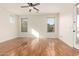 Bright bedroom with hardwood floors and multiple windows at 31032 N Obsidian Dr, San Tan Valley, AZ 85143