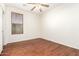 Simple bedroom with hardwood floors and a window at 31032 N Obsidian Dr, San Tan Valley, AZ 85143