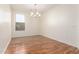 Simple dining room with hardwood floors and a chandelier at 31032 N Obsidian Dr, San Tan Valley, AZ 85143