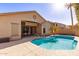 Relaxing kidney-shaped pool with ample surrounding patio space at 31032 N Obsidian Dr, San Tan Valley, AZ 85143