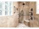 Large walk-in shower with multiple shower heads and tile at 31032 N Obsidian Dr, San Tan Valley, AZ 85143