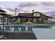 Community pool and clubhouse with lounge chairs at 3208 E Hayden Rose Ave, San Tan Valley, AZ 85143