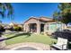 Landscaped backyard with covered patio and grassy area at 3331 E Coconino Dr, Gilbert, AZ 85298