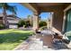 Covered patio with seating area and grassy backyard at 3331 E Coconino Dr, Gilbert, AZ 85298