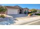 Single story home with a two-car garage and well-maintained landscaping at 3331 E Coconino Dr, Gilbert, AZ 85298