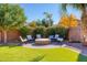 Landscaped backyard with firepit and seating area at 3331 E Coconino Dr, Gilbert, AZ 85298