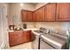 Laundry room with washer, dryer, and ample cabinet space at 3331 E Coconino Dr, Gilbert, AZ 85298