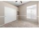 Well-lit bedroom featuring built-in shelves and closet at 3403 E Wyatt Way, Gilbert, AZ 85297