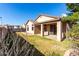 Home's back exterior, showing patio and yard at 3403 E Wyatt Way, Gilbert, AZ 85297