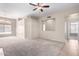 Living room with fireplace and neutral carpeting and paint at 3403 E Wyatt Way, Gilbert, AZ 85297