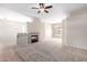 Open living room with neutral carpeting and a ceiling fan at 3403 E Wyatt Way, Gilbert, AZ 85297