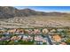 Aerial perspective of neighborhood near mountains at 3611 E Kachina Dr, Phoenix, AZ 85044