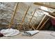 Unfinished attic space with exposed beams and foam insulation at 3611 E Kachina Dr, Phoenix, AZ 85044