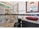 Bathroom with a glass shower, modern vanity, and red vessel sink at 3611 E Kachina Dr, Phoenix, AZ 85044