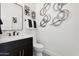 Modern bathroom with dark vanity and contemporary fixtures at 3611 E Kachina Dr, Phoenix, AZ 85044