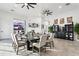 Modern dining room with large table, adjacent to a wine storage cabinet at 3611 E Kachina Dr, Phoenix, AZ 85044