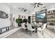 Modern dining room with large table, fireplace, and sliding doors to patio at 3611 E Kachina Dr, Phoenix, AZ 85044