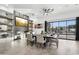 Modern dining room with large table, fireplace, and sliding doors to patio at 3611 E Kachina Dr, Phoenix, AZ 85044