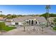 Elegant home exterior featuring a circular driveway and fountain at 3611 E Kachina Dr, Phoenix, AZ 85044