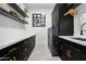 Laundry room with black cabinets, quartz countertops, and modern sink at 3611 E Kachina Dr, Phoenix, AZ 85044