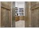 Walk-in pantry with ample shelving for storage and high-end appliances at 3611 E Kachina Dr, Phoenix, AZ 85044