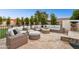 Outdoor patio with wicker furniture and fire pit at 3611 E Kachina Dr, Phoenix, AZ 85044