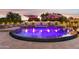 Expansive pool and spa with fire features at dusk at 3611 E Kachina Dr, Phoenix, AZ 85044