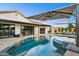 Luxury pool with outdoor seating and umbrellas at 3611 E Kachina Dr, Phoenix, AZ 85044