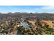 Aerial view of park with pond, sports fields, and mountains at 3645 E Shaw Butte Dr, Phoenix, AZ 85028