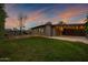 Backyard view of home with a patio, string lights, and garden at 3645 E Shaw Butte Dr, Phoenix, AZ 85028