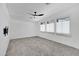 Bright bedroom with ceiling fan and plush carpeting at 3645 E Shaw Butte Dr, Phoenix, AZ 85028