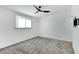 Bright bedroom with ceiling fan and window at 3645 E Shaw Butte Dr, Phoenix, AZ 85028