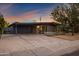 Mid-century modern home at sunset with landscaping at 3645 E Shaw Butte Dr, Phoenix, AZ 85028