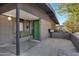 Mid-century modern home's front entry with green door at 3645 E Shaw Butte Dr, Phoenix, AZ 85028