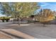 Mid-century modern home with mature trees and gravel landscaping at 3645 E Shaw Butte Dr, Phoenix, AZ 85028