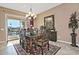 Bright dining area with patio access and an exquisite chandelier at 3649 N Hudson Dr, Florence, AZ 85132