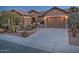 Two-car garage home with desert landscaping at 3649 N Hudson Dr, Florence, AZ 85132