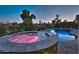 Romantic hot tub and pool area at night at 3649 N Hudson Dr, Florence, AZ 85132